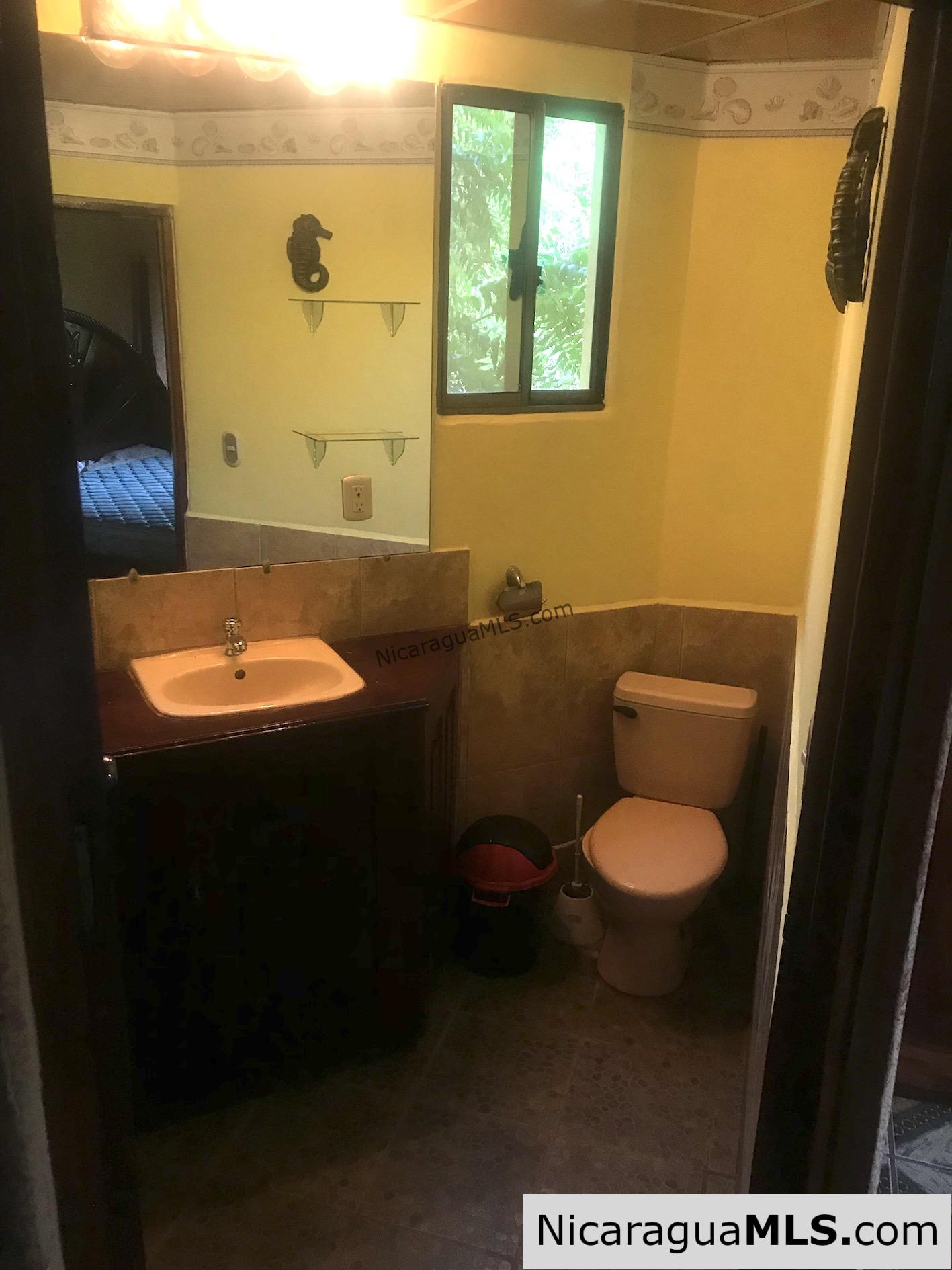 3 bedroom house with rental apartment within walking distance to the beach