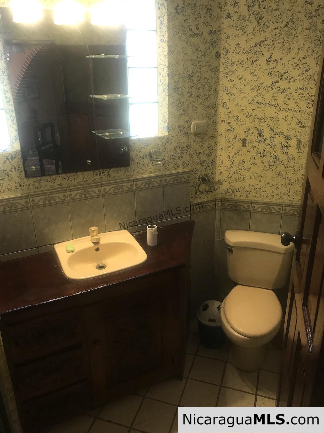 3 bedroom house with rental apartment within walking distance to the beach